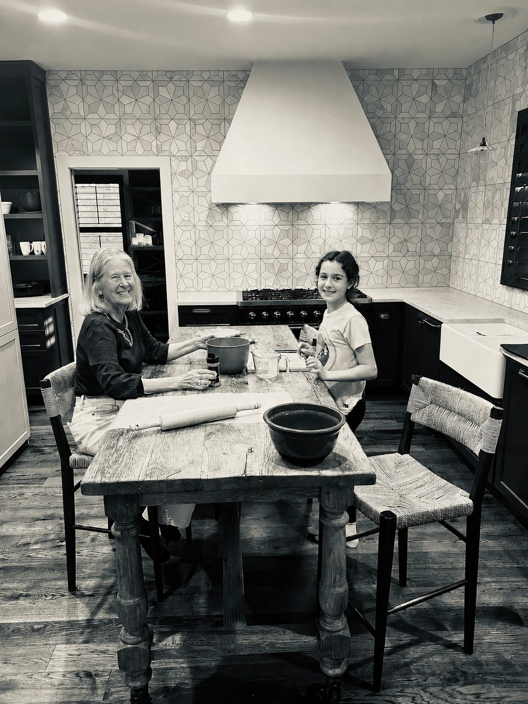 Vi and her granddaughter baking together in the kitchen